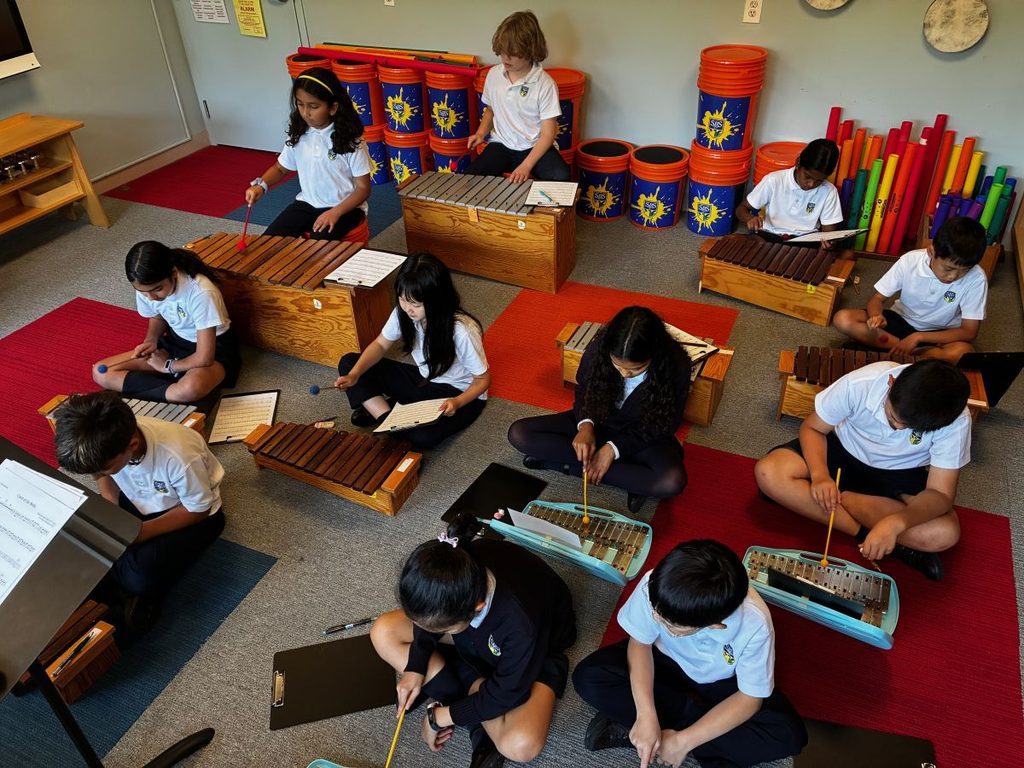 Grade 5 students playing xylophones.